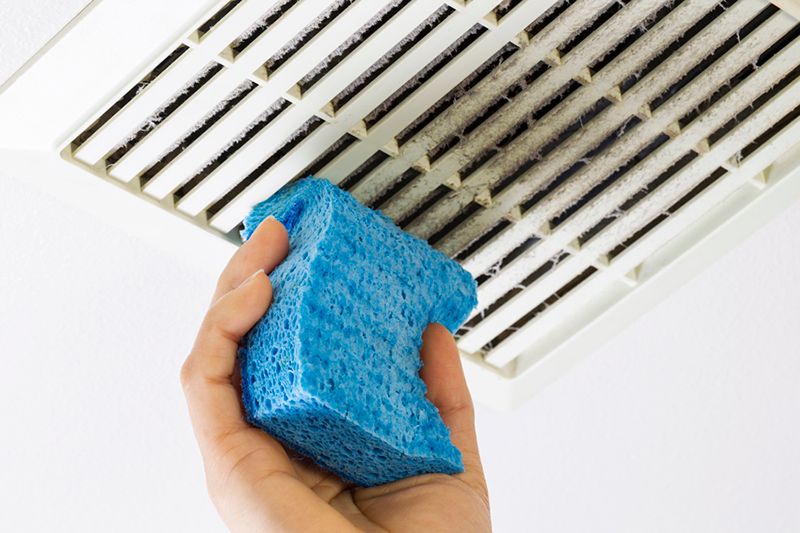 Image of someone cleaning air duct. Why Air Duct Cleaning Is Important.
